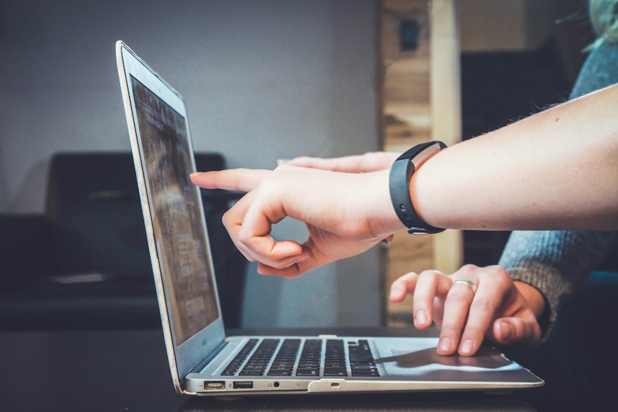 Creative collaborators reviewing content together on a laptop